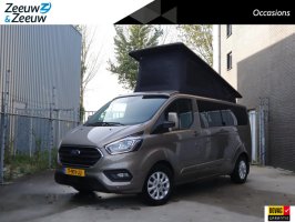 Ford Transit Custom 2.0 TDCI L2H1 Limited Camper 170pk automaat | Camper met 2 slaapplaatsen | Extra breed bed | Keuken met gootsteen- koelkast- gasfornuis | Zonnescherm | Cruise control | Trekhaak | Extra opbergruimte | Stoelverwarming | Voorruitverwarming | Navigatie