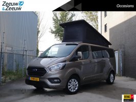Ford Transit Custom 2.0 TDCI L2H1 Limited Camper 170hp automatic | Camper with 2 sleeping places | Extra wide bed | Kitchen with sink, refrigerator, gas stove Sunshade | Cruise control | Tow bar | Extra storage space | Seat heating | Windscreen heating | Navigation